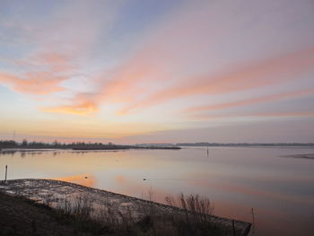 Scenic view of sea at sunset