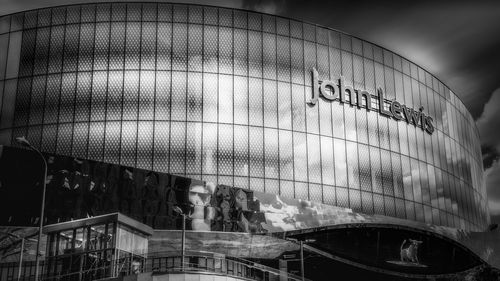 Low angle view of modern building seen through glass