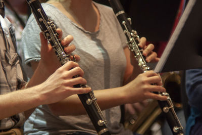 Midsection of people playing guitar