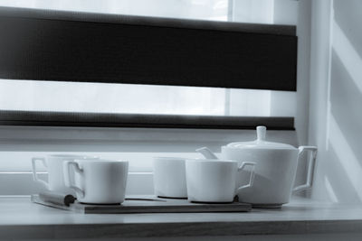 Close-up of coffee cup on table at home