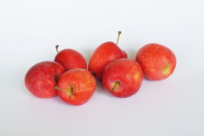 High angle view of apples on white background