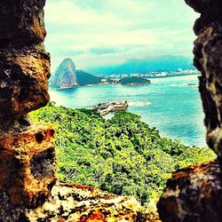 Scenic view of sea against cloudy sky