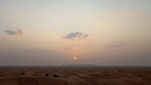 Scenic view of landscape against sky during sunset