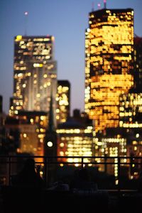 Illuminated buildings in city at night