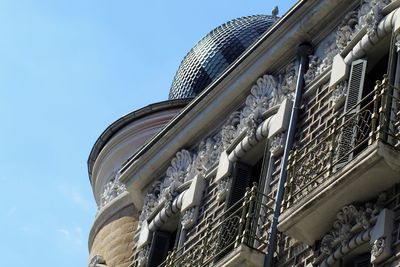 Low angle view of building against clear blue sky