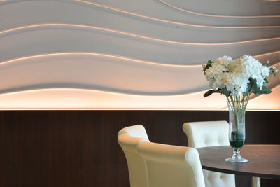 Close-up of flower vase on table at home