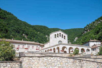 View of historic building against clear blue sky