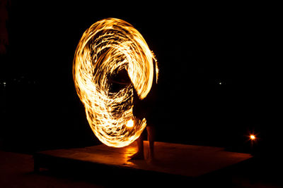 Blurred motion of illuminated fire at night