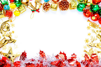 High angle view of multi colored candies against white background