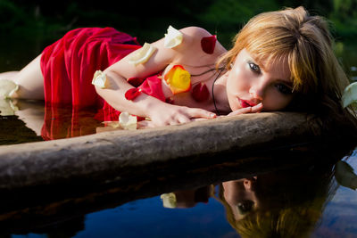 Side view of a girl looking at river