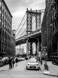 Cars on city against sky