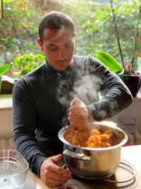 Man preparing food on table