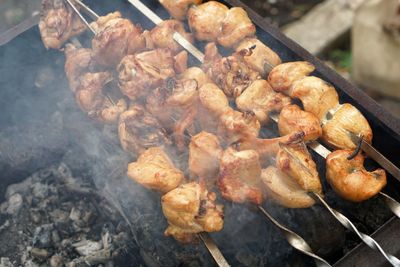 High angle view of meat on barbecue