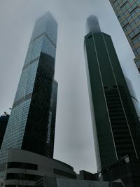 Low angle view of modern buildings against sky in city