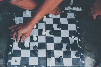 High angle view of men playing on table