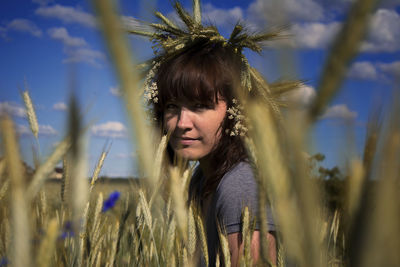Portrait of young woman on wheat field