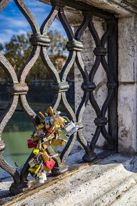 Close-up of padlocks on chainlink fence