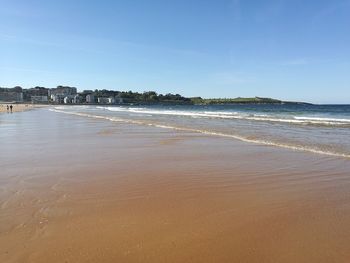 Scenic view of beach against clear sky