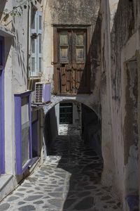 Traditional alley road in chora district of naxos island, with houses