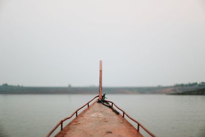 Calm sea against clear sky