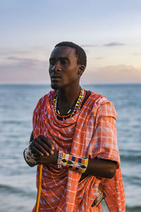 Man looking at sea against sky