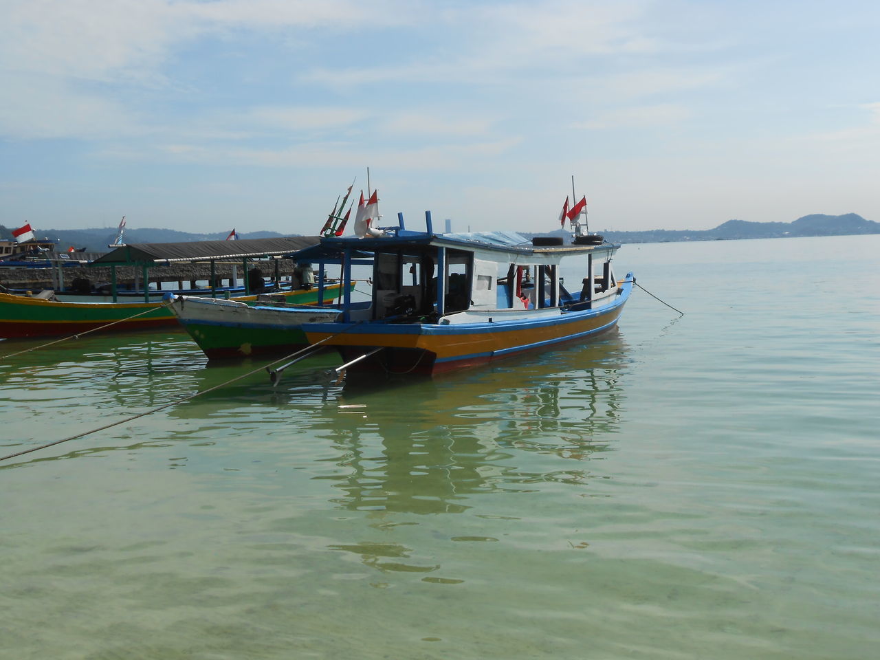 water, transportation, nautical vessel, mode of transportation, sea, boat, vehicle, boating, sky, nature, travel, bay, coast, day, ship, travel destinations, cloud, watercraft, outdoors, beauty in nature, tourism, no people, tranquility, reflection, waterfront, scenics - nature, land, long-tail boat, architecture, beach, tranquil scene