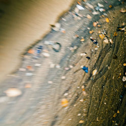 Close-up of man on sand at beach