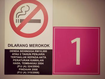 Close-up of warning sign on wall