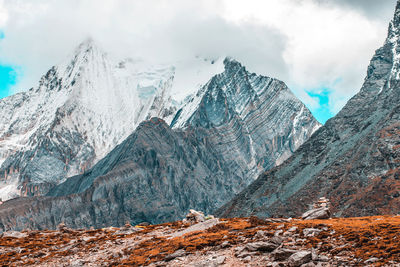 Panoramic view of snowcapped mountains against sky