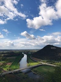 Scenic view of lake against sky in city