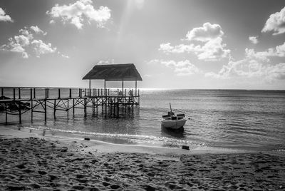 Scenic view of sea against cloudy sky