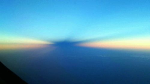 Aerial view of landscape against sky at sunset