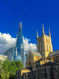 Low angle view of buildings against blue sky