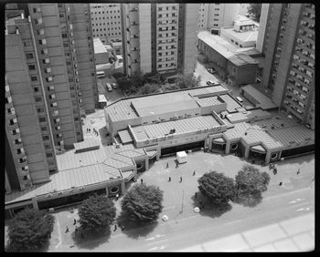 High angle view of road by buildings in city