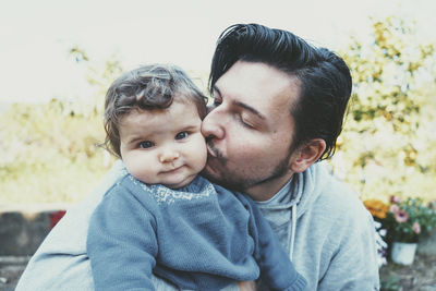 Portrait of father with baby