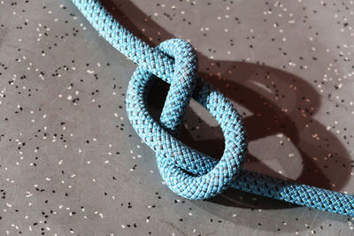 High angle view of rope on marble