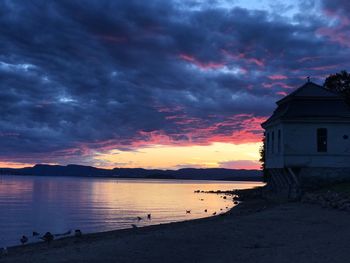 Scenic view of sea against dramatic sky