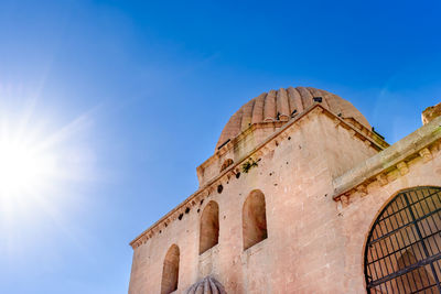 Low angle view of historical building against blue sky