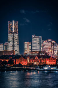 Illuminated buildings in city at night