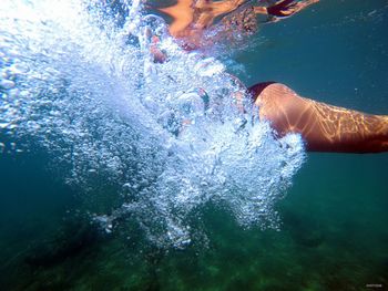 Woman swimming in sea