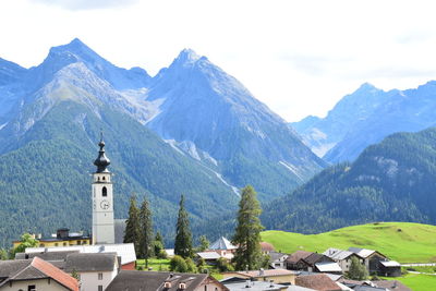 High angle view of houses and mountains against sky