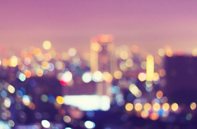 Defocused image of illuminated lights at night