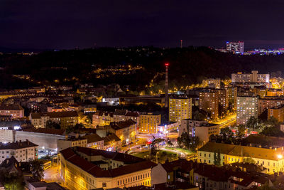 High angle view of illuminated buildings in city at night