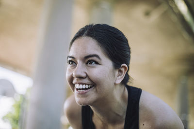 Happy woman laughing while exercising