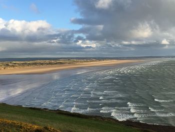 Scenic view of beach against sky