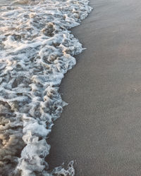 High angle view of surf on beach