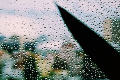 Full frame shot of wet glass window in rainy season