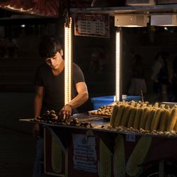 Man preparing food at market stall