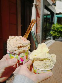 Person holding ice cream cone