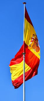 Low angle view of flag against clear sky